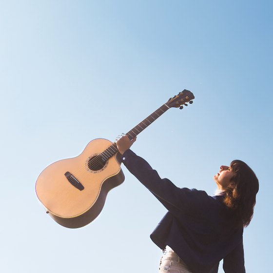 Matilde holding her guitar